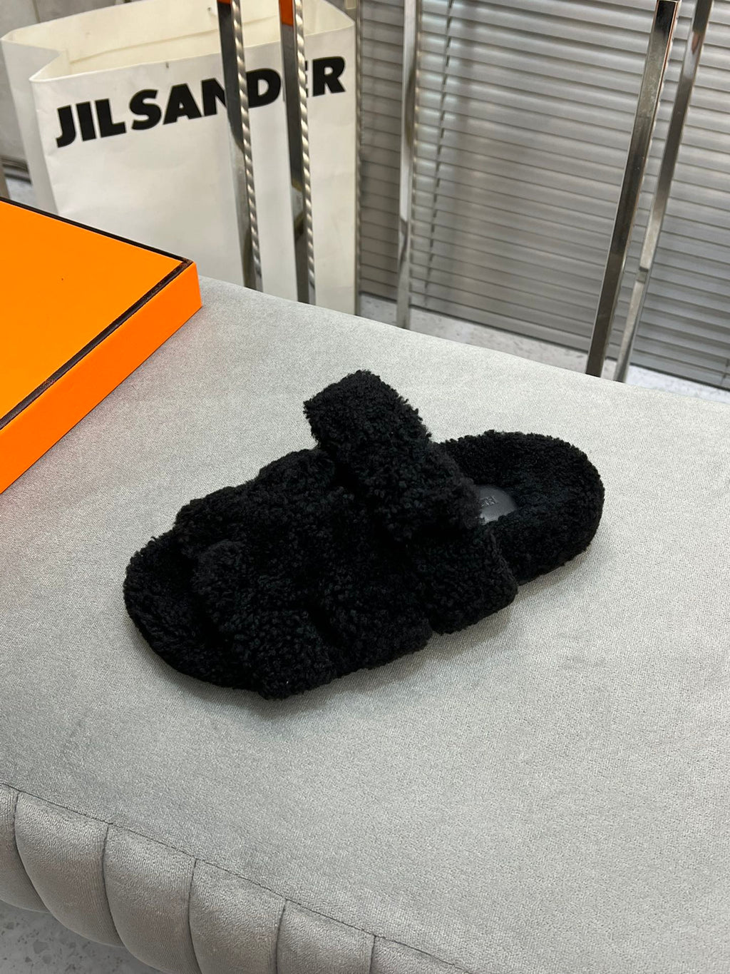 Hermes Chypre Slippers in Black Lamb Wool