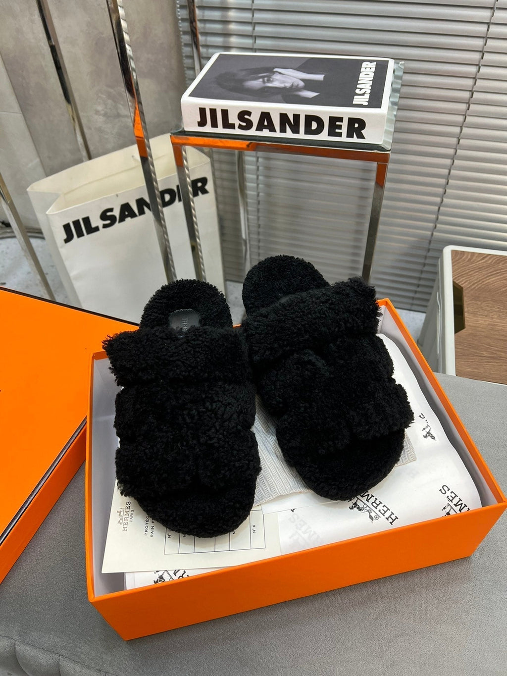 Hermes Chypre Slippers in Black Lamb Wool