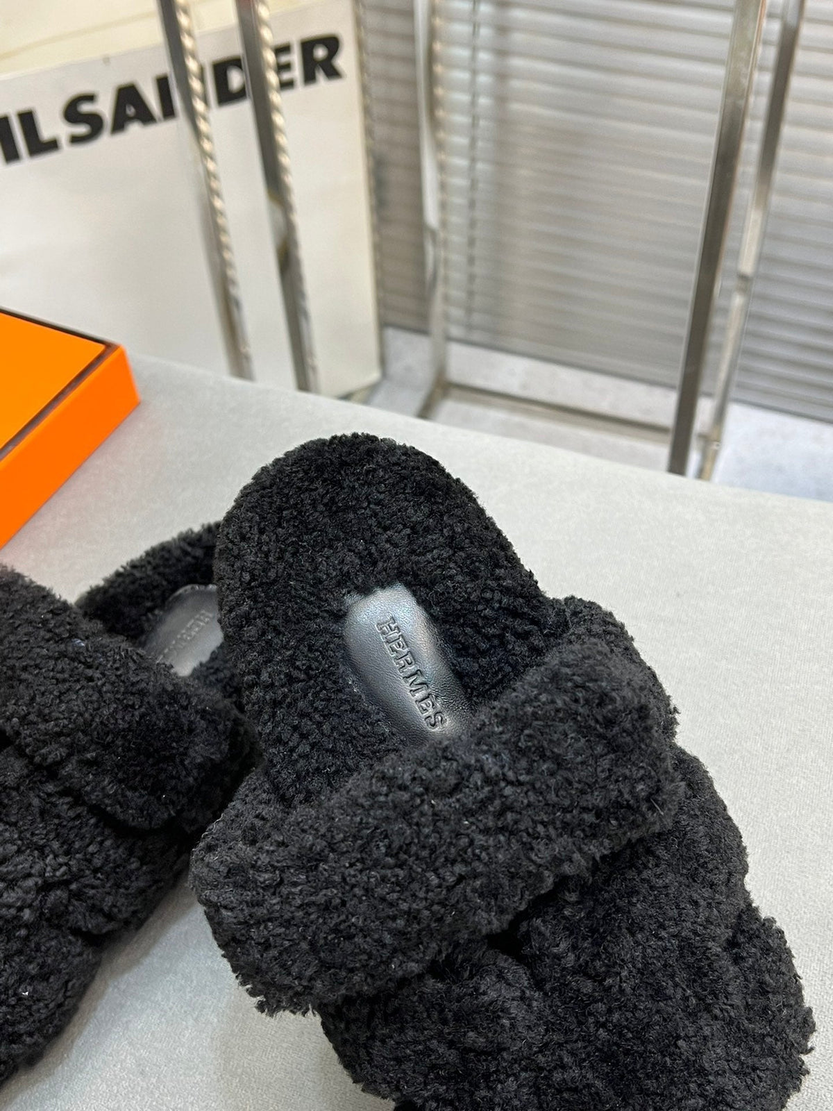 Hermes Chypre Slippers in Black Lamb Wool