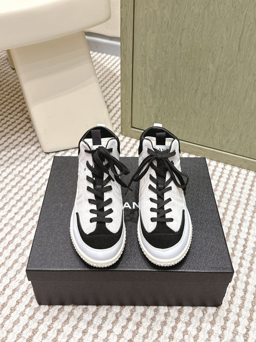 Chanel 25S High-Top Sneakers in Black and White Calfskin and Suede