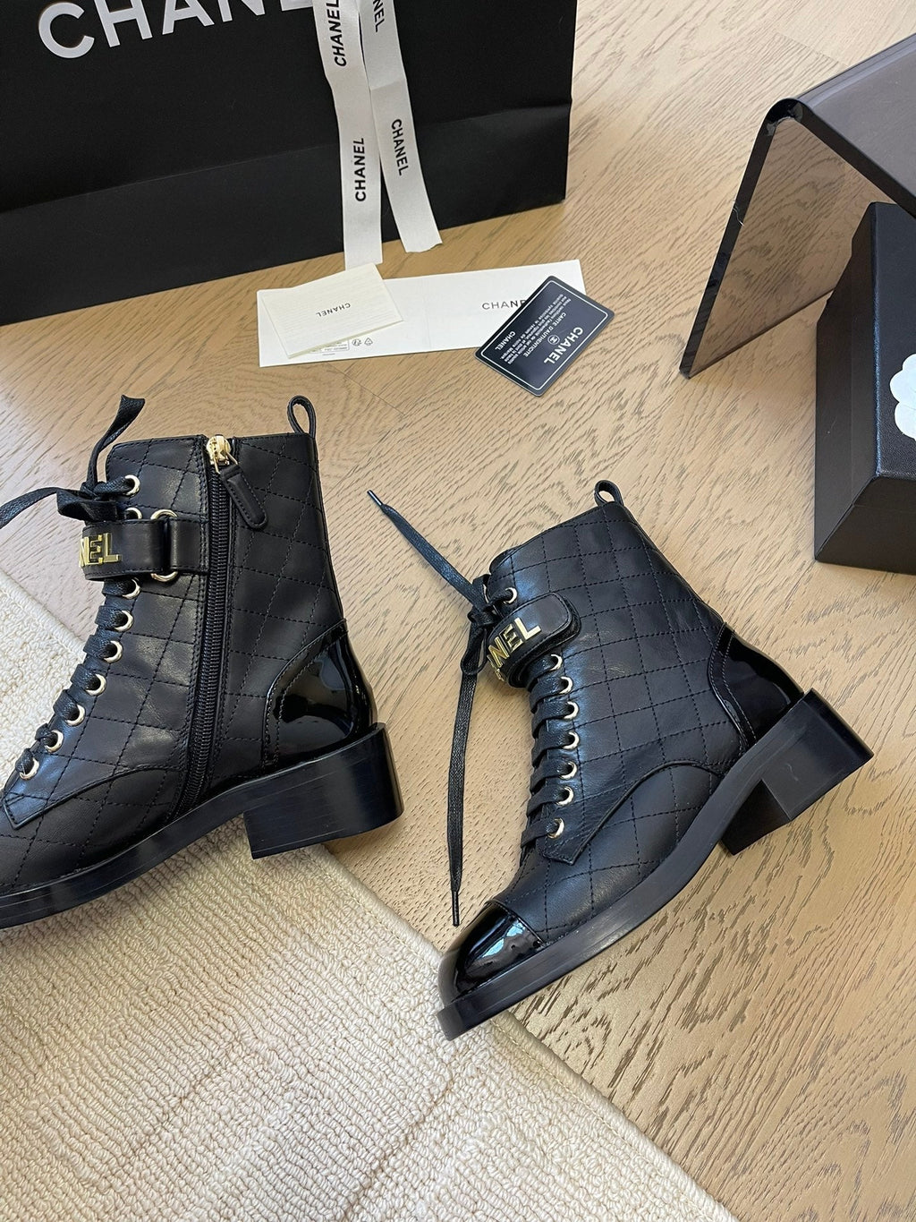 Chanel Alphabet Martin Boots in Black Lambskin