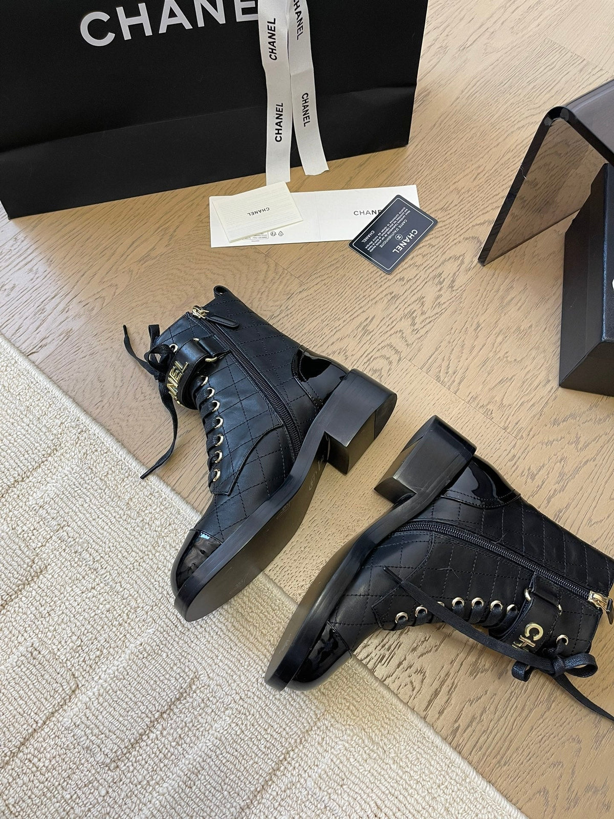 Chanel Alphabet Martin Boots in Black Lambskin
