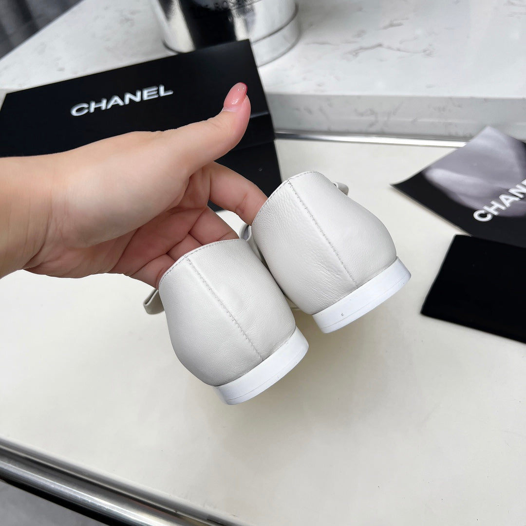 Chanel 25S Mary Janes in White Mix Black Calfskin with Bow Gold Hardware