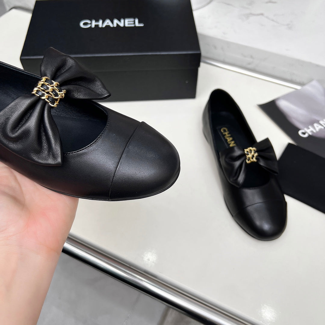 Chanel 25S Mary Janes in Black Calfskin with Bow Gold Hardwre