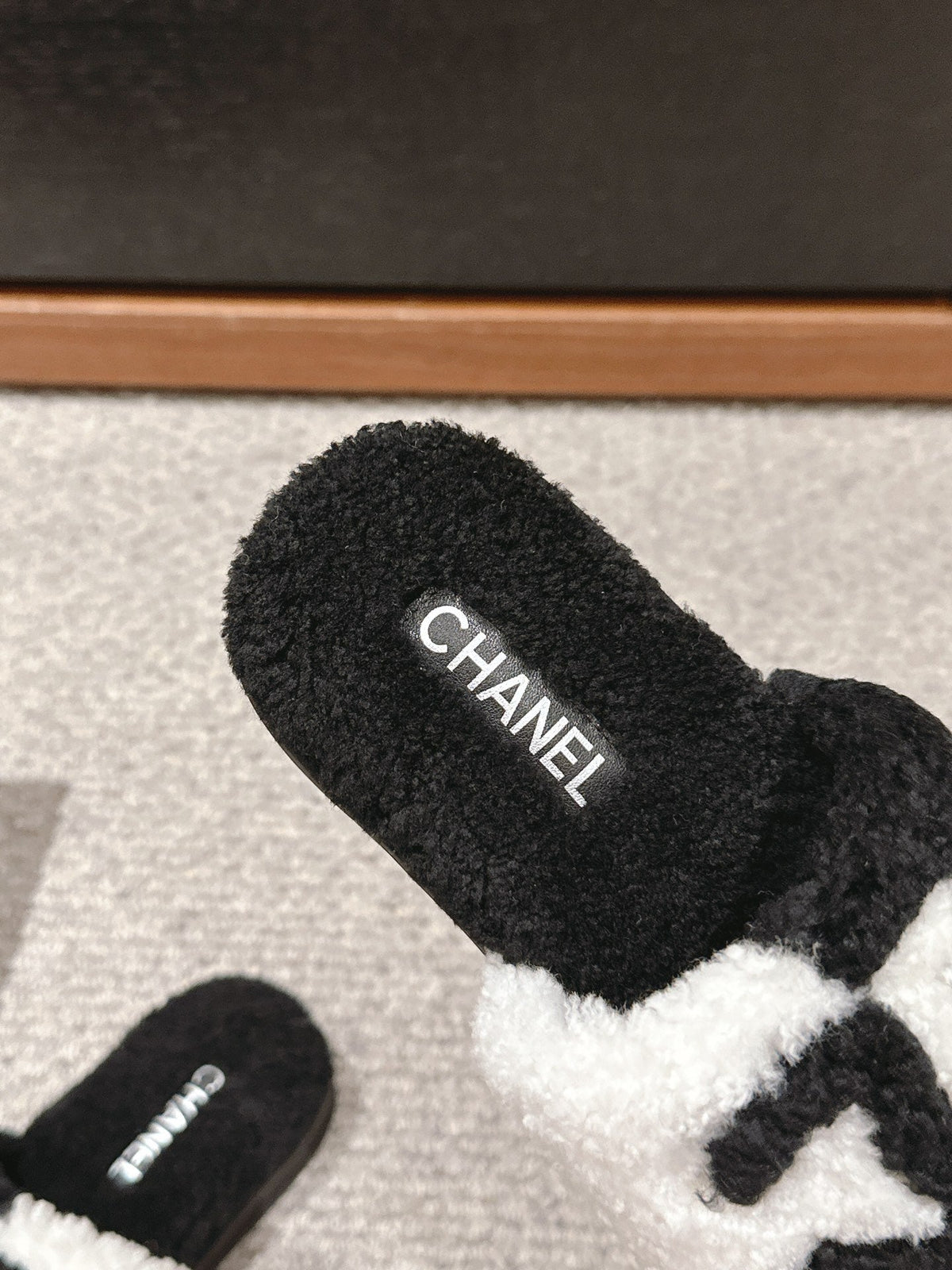 Chanel Slippers in Black Mix White Fleece