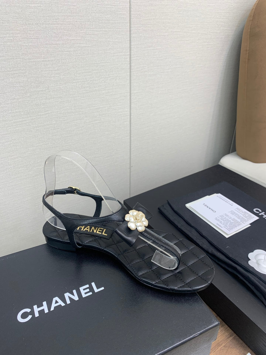 Chanel Thong Sandal in Black Lambskin with Pearl Flower