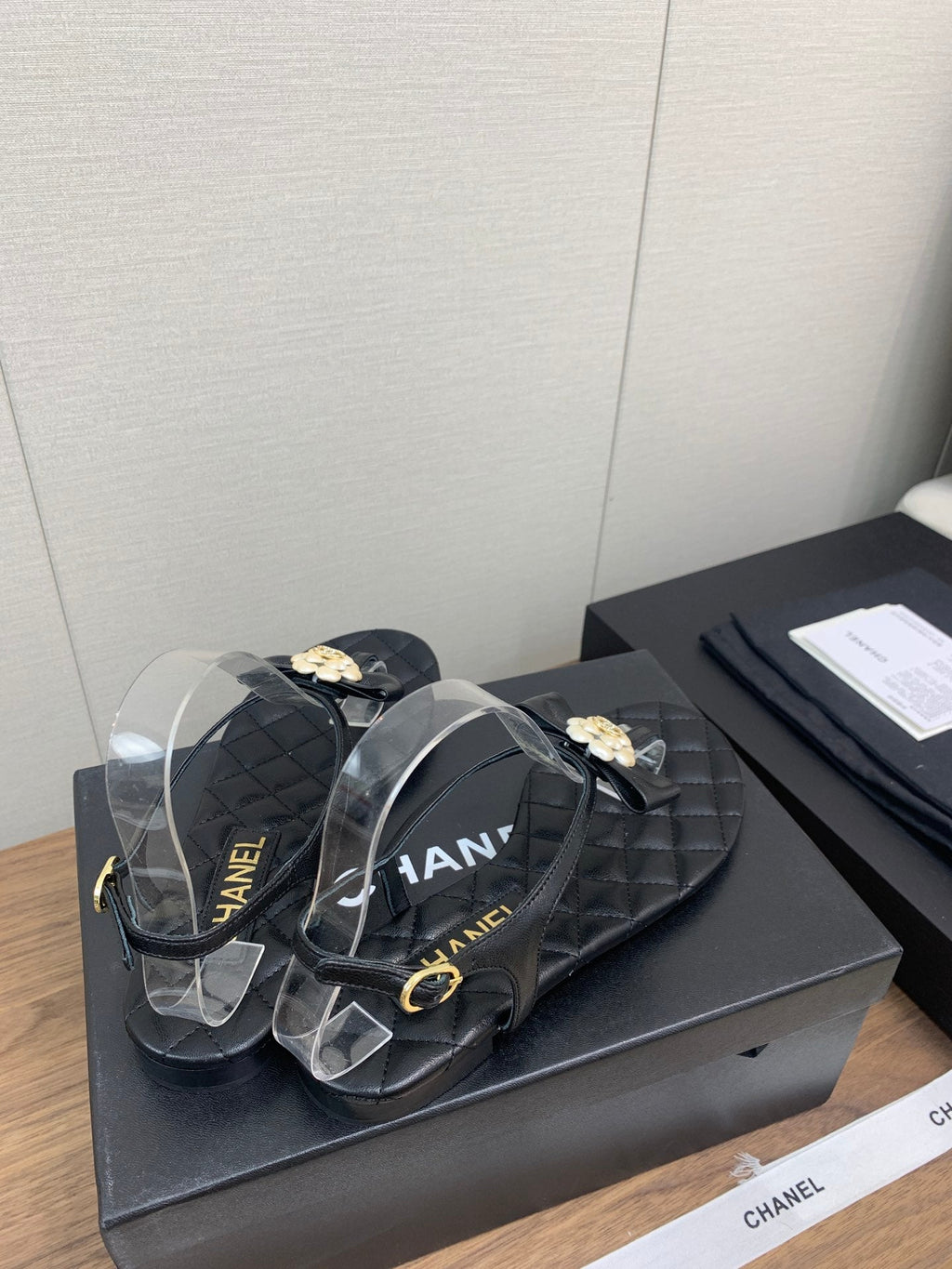 Chanel Thong Sandal in Black Lambskin with Pearl Flower