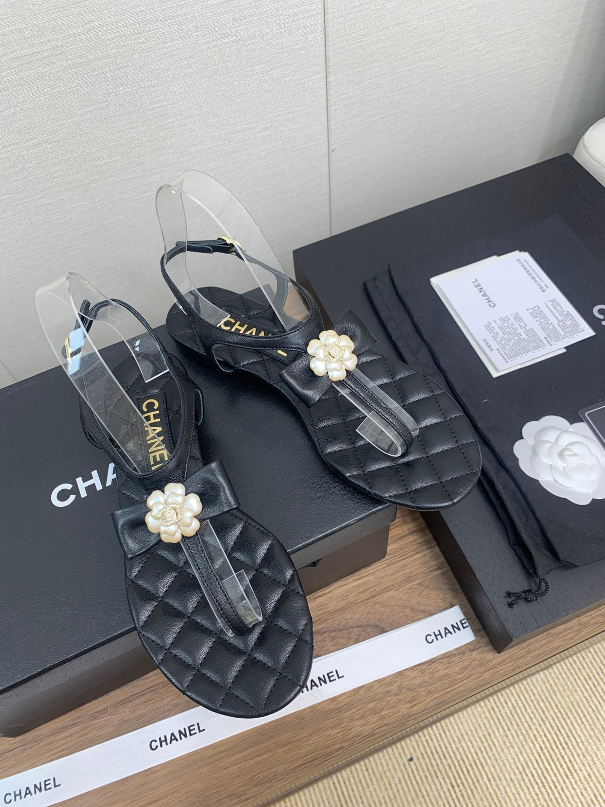 Chanel Thong Sandal in Black Lambskin with Pearl Flower