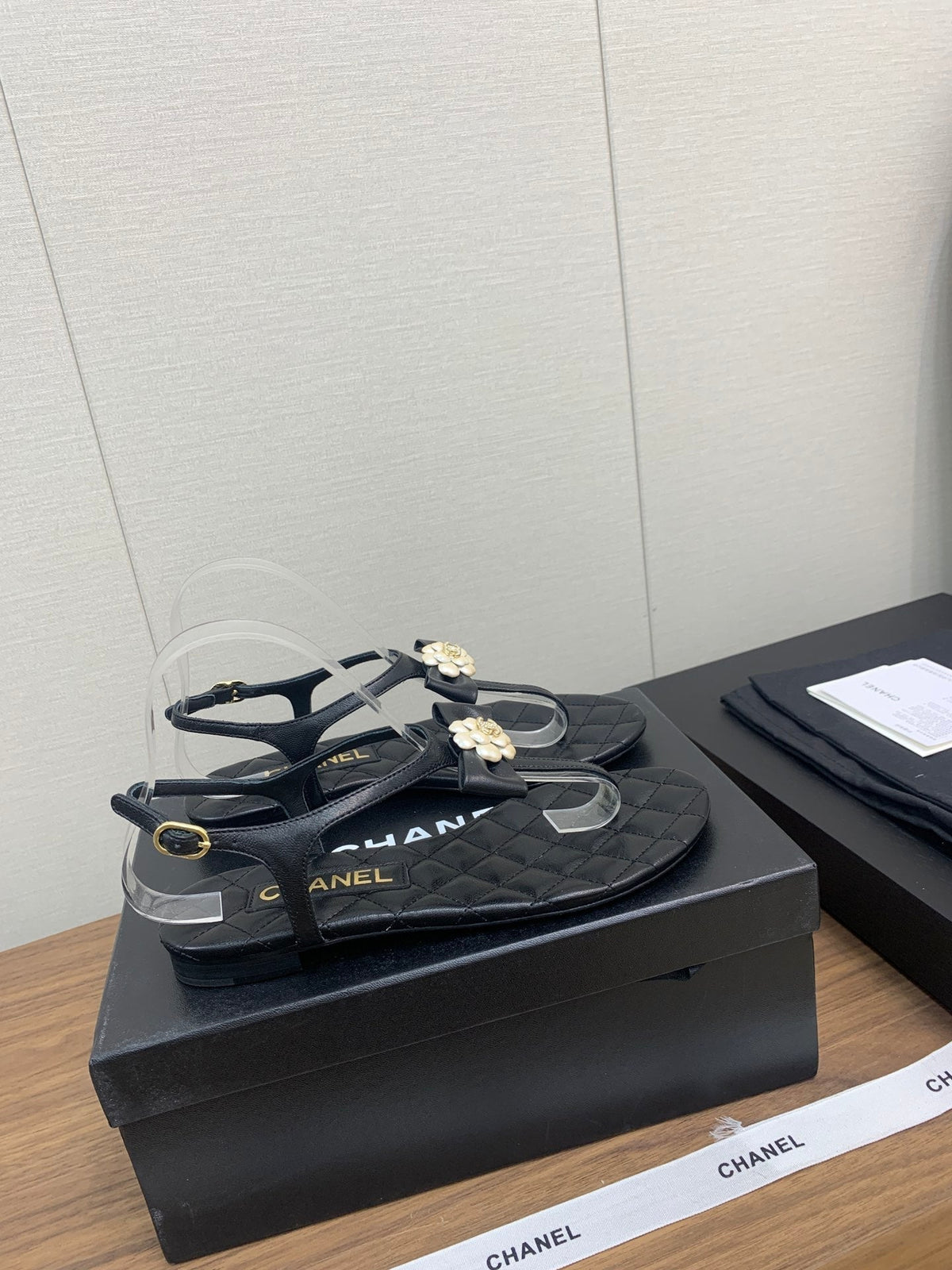 Chanel Thong Sandal in Black Lambskin with Pearl Flower