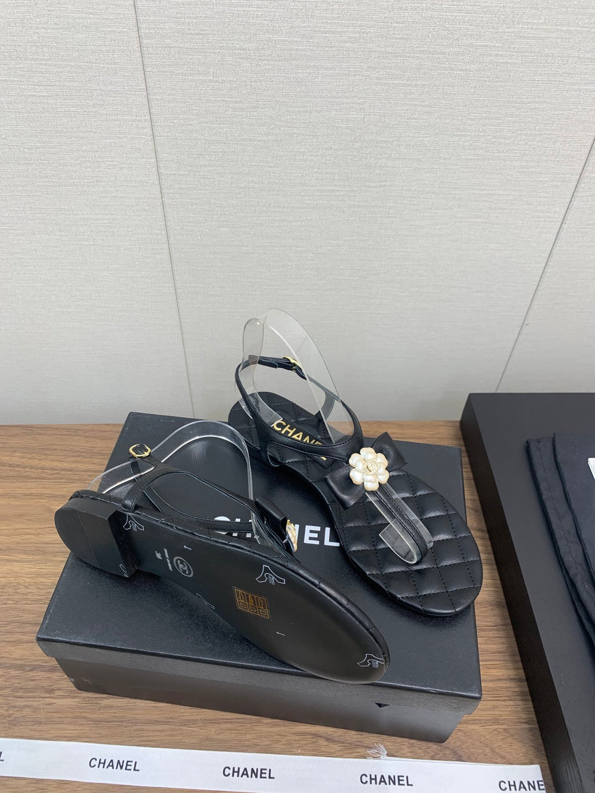 Chanel Thong Sandal in Black Lambskin with Pearl Flower