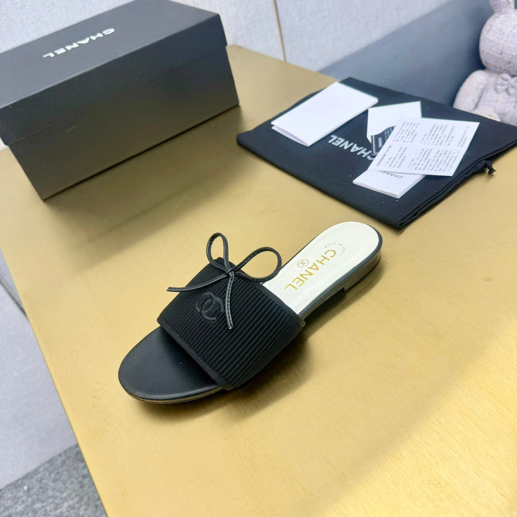 Chanel Bow Slippers in Black Lambskin