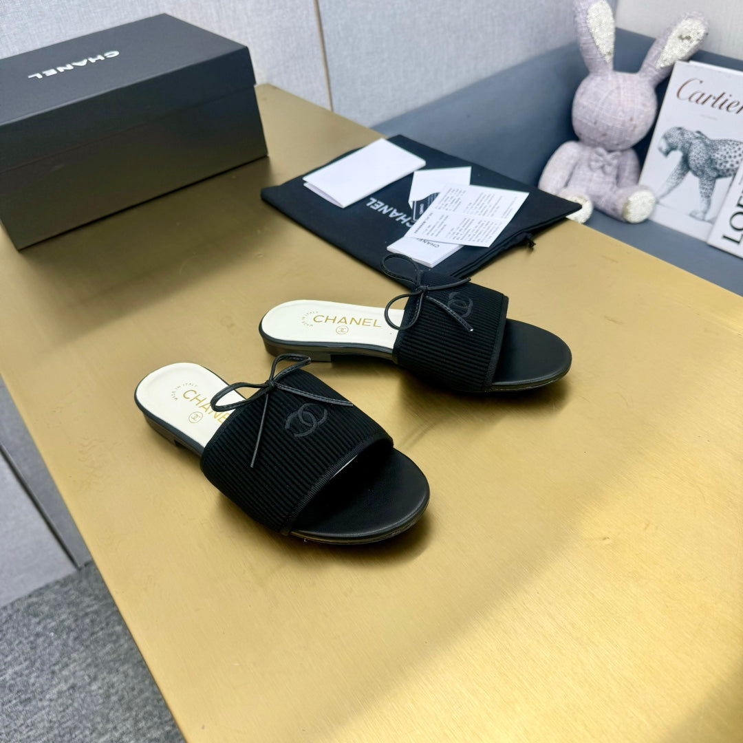 Chanel Bow Slippers in Black Lambskin