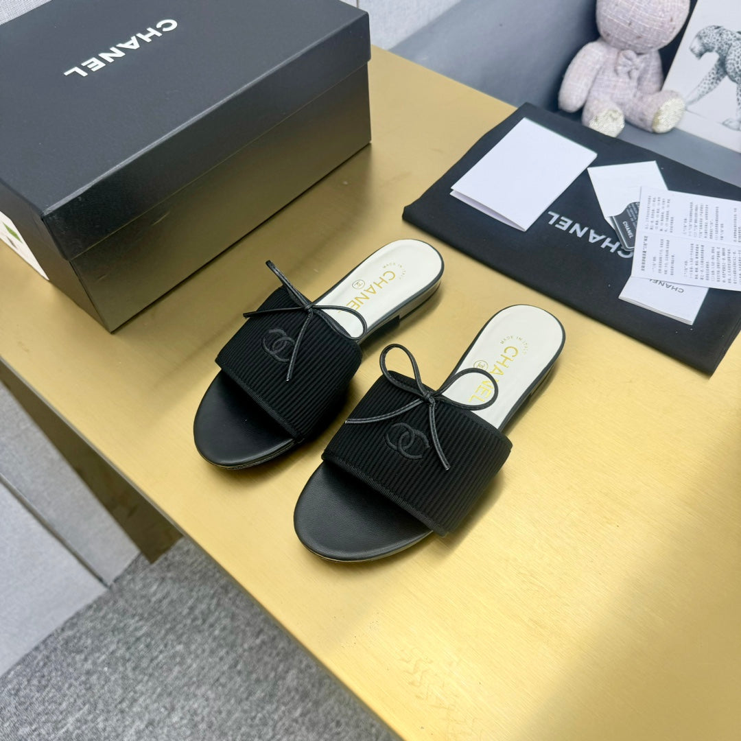 Chanel Bow Slippers in Black Lambskin