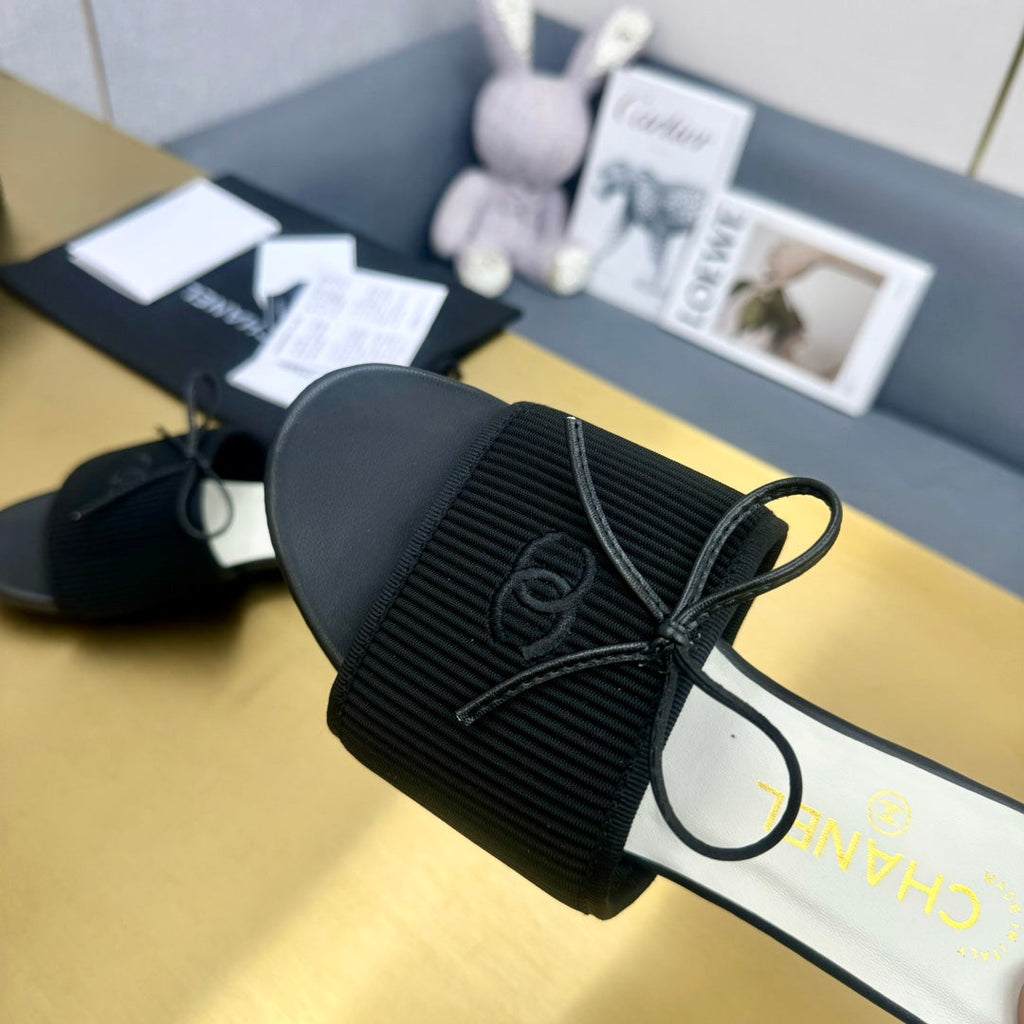 Chanel Bow Slippers in Black Lambskin