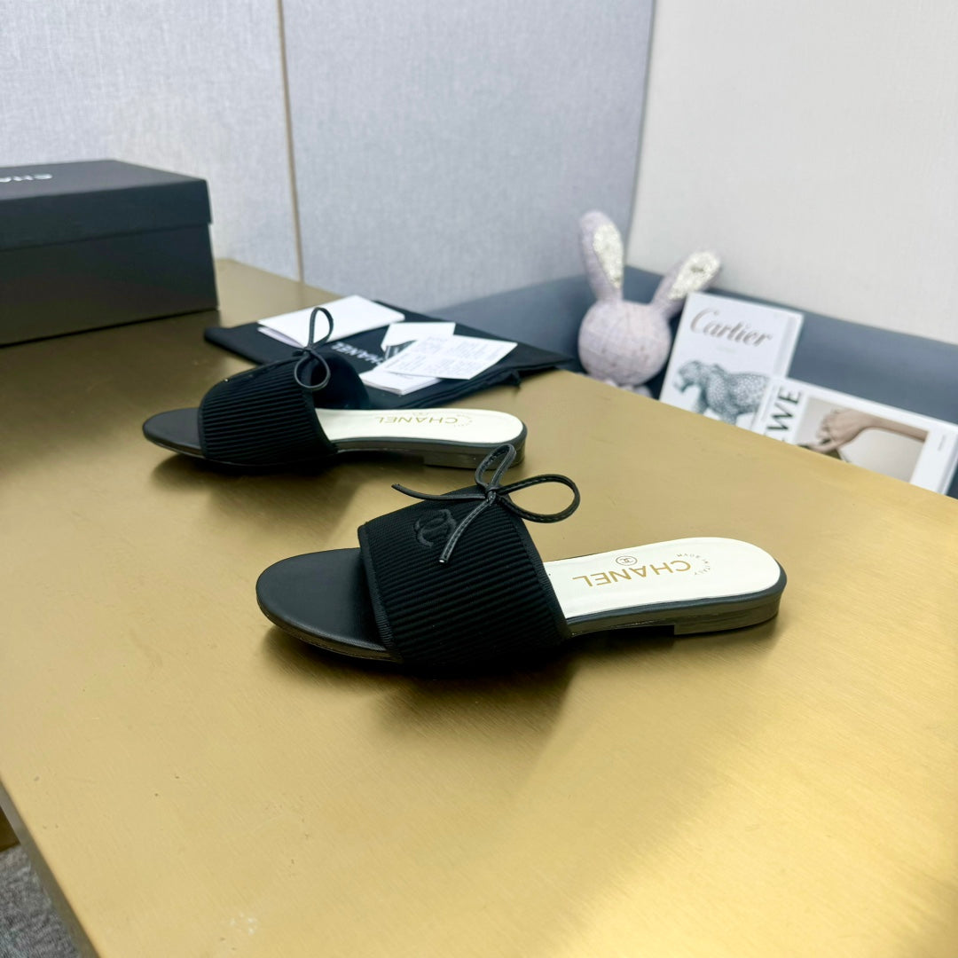 Chanel Bow Slippers in Black Lambskin