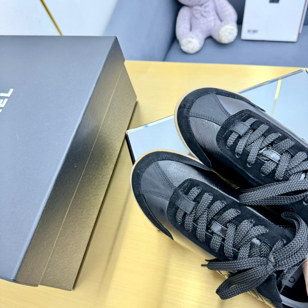 Chanel Sneaker in Black Calfskin and Suede
