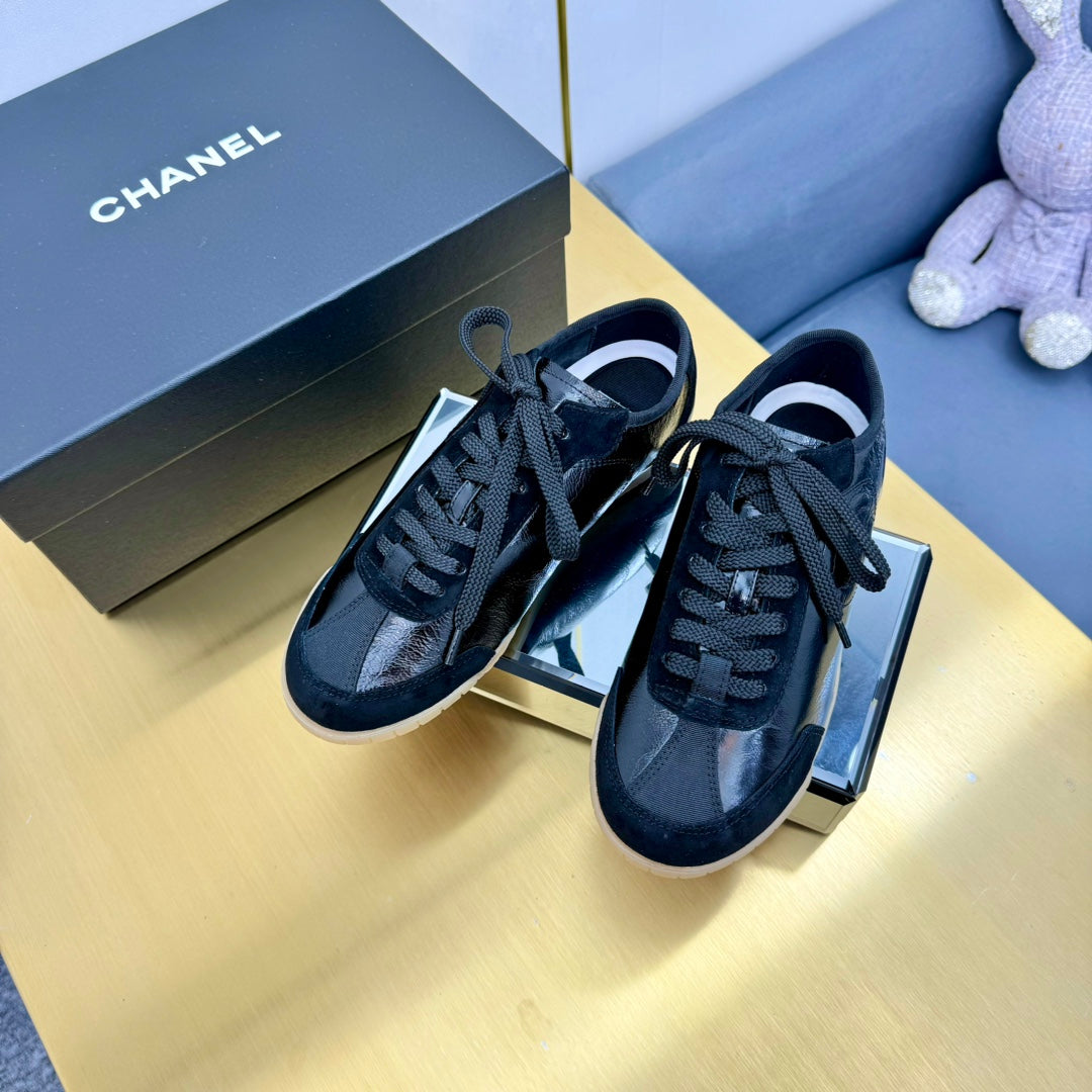 Chanel Sneaker in Black Calfskin and Suede