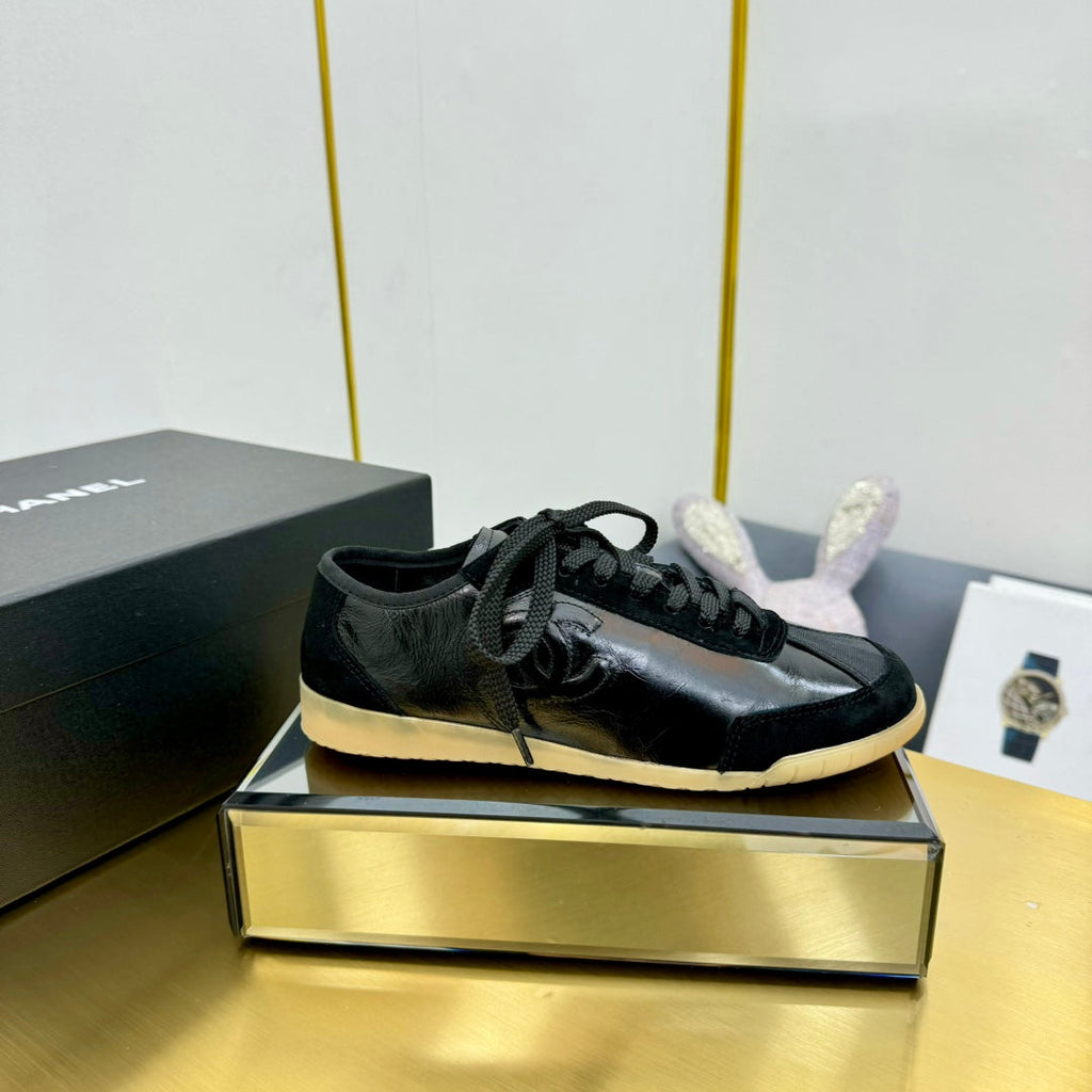Chanel Sneaker in Black Calfskin and Suede