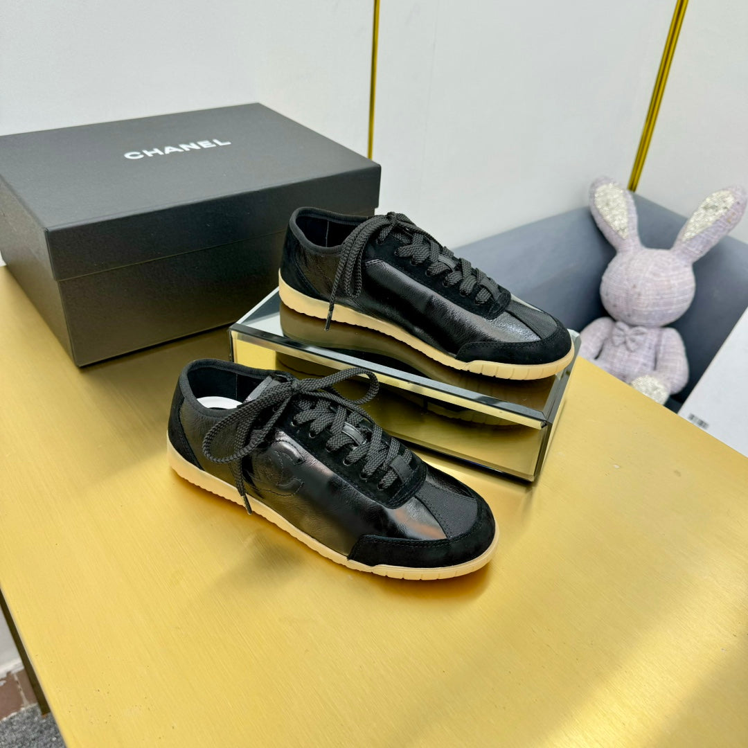 Chanel Sneaker in Black Calfskin and Suede