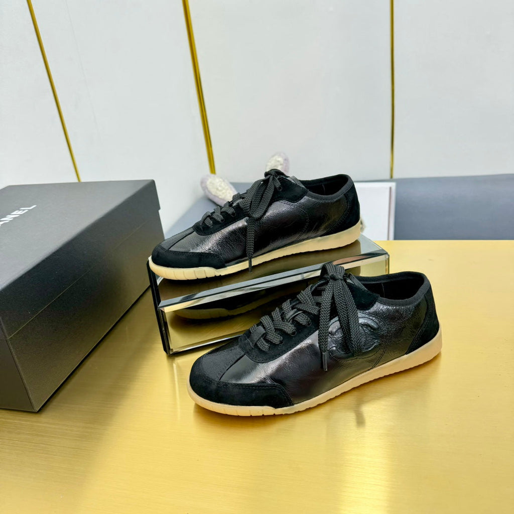 Chanel Sneaker in Black Calfskin and Suede