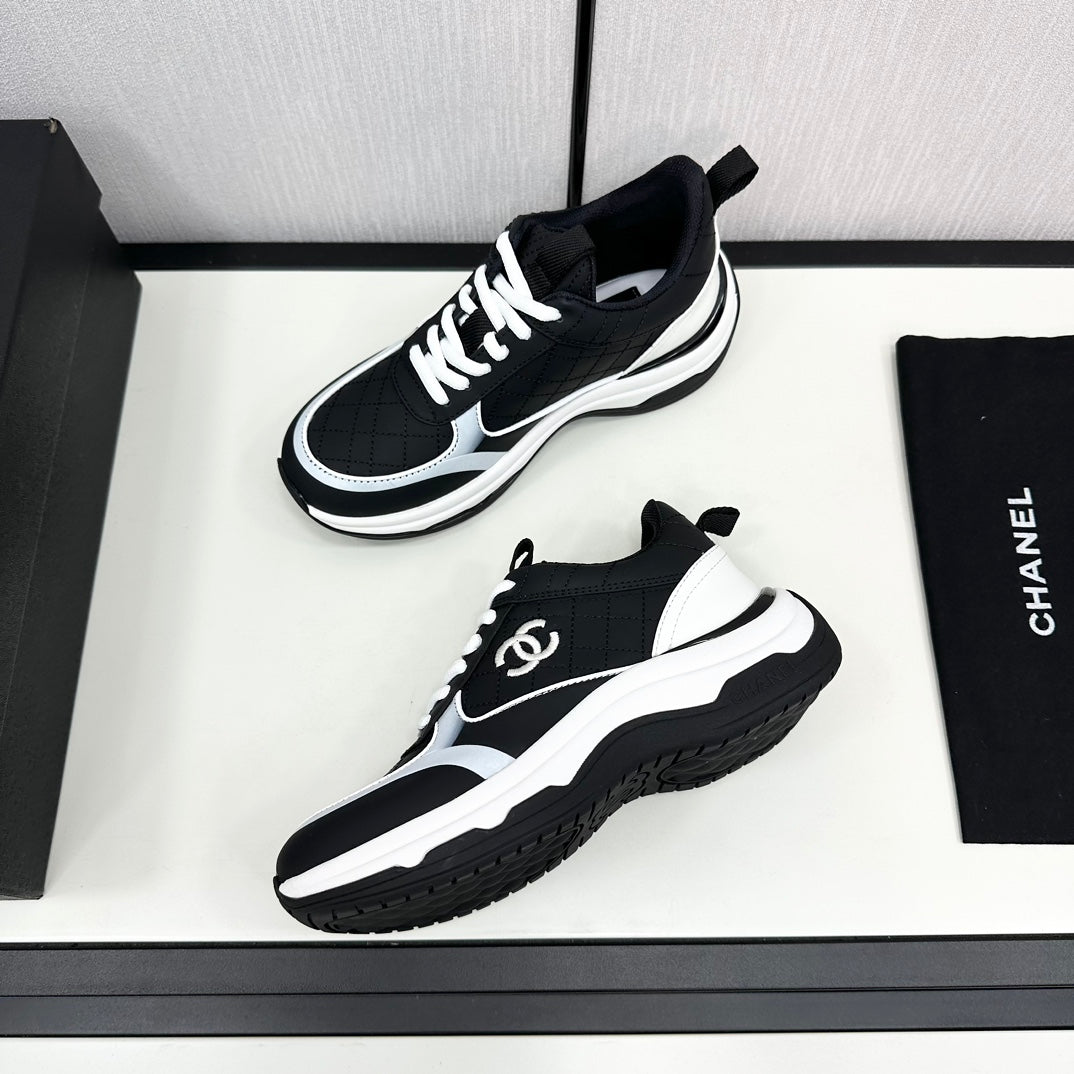 Chanel Sneaker in Black Mix White Embroidered Lambskin