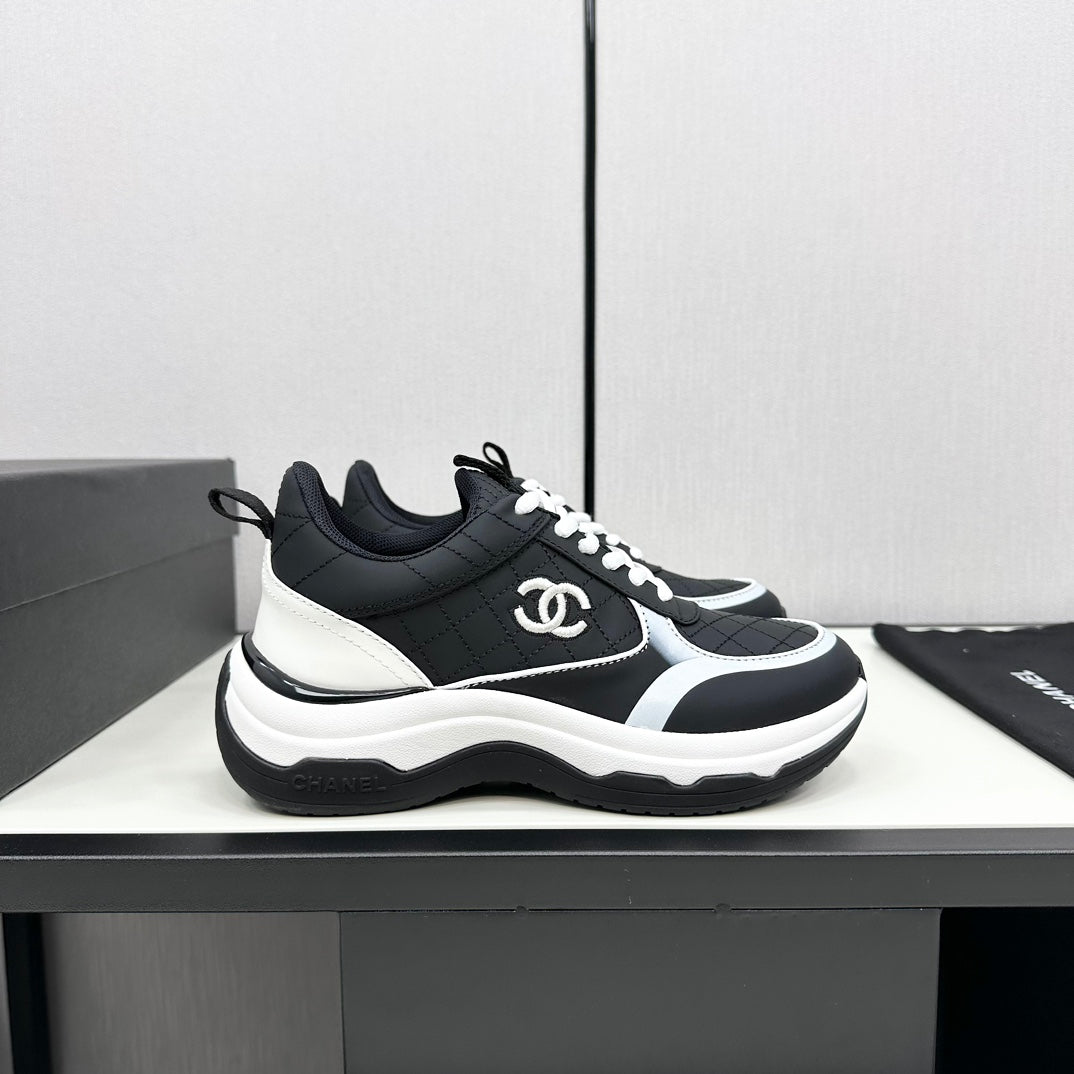 Chanel Sneaker in Black Mix White Embroidered Lambskin
